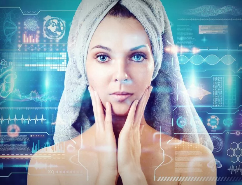 A woman with a towel wrapped on her head touches her face, behind her are futuristic digital data and graphics.